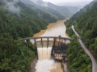 An aerial photo is showing the flood discharge at the Yongli Hydropower Station in Congjiang County, Southwest China's Guizhou Province, on...