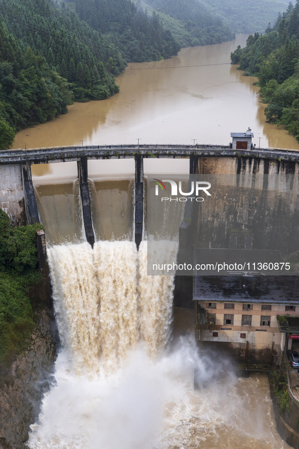 An aerial photo is showing the flood discharge at the Yongli Hydropower Station in Congjiang County, Southwest China's Guizhou Province, on...