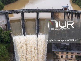 An aerial photo is showing the flood discharge at the Yongli Hydropower Station in Congjiang County, Southwest China's Guizhou Province, on...