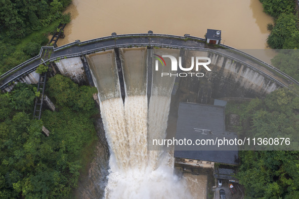 An aerial photo is showing the flood discharge at the Yongli Hydropower Station in Congjiang County, Southwest China's Guizhou Province, on...