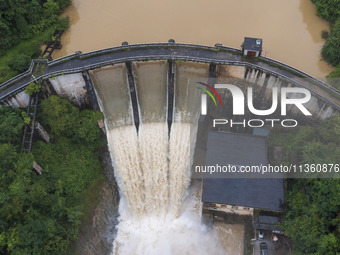 An aerial photo is showing the flood discharge at the Yongli Hydropower Station in Congjiang County, Southwest China's Guizhou Province, on...