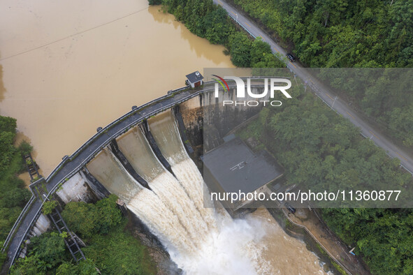 An aerial photo is showing the flood discharge at the Yongli Hydropower Station in Congjiang County, Southwest China's Guizhou Province, on...