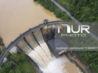 An aerial photo is showing the flood discharge at the Yongli Hydropower Station in Congjiang County, Southwest China's Guizhou Province, on...