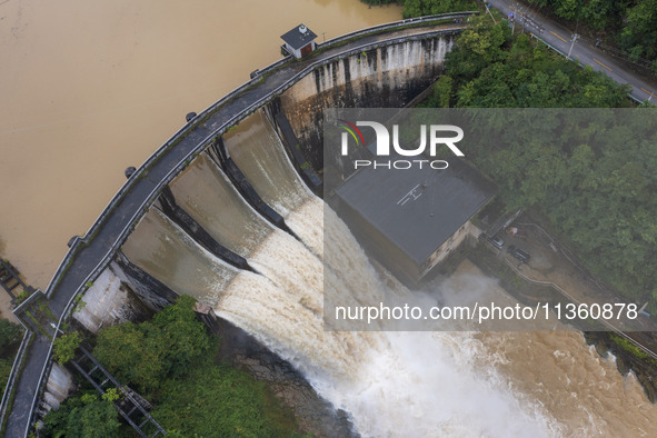 An aerial photo is showing the flood discharge at the Yongli Hydropower Station in Congjiang County, Southwest China's Guizhou Province, on...