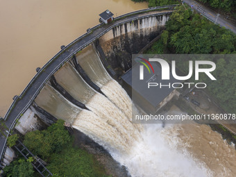 An aerial photo is showing the flood discharge at the Yongli Hydropower Station in Congjiang County, Southwest China's Guizhou Province, on...