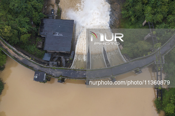 An aerial photo is showing the flood discharge at the Yongli Hydropower Station in Congjiang County, Southwest China's Guizhou Province, on...