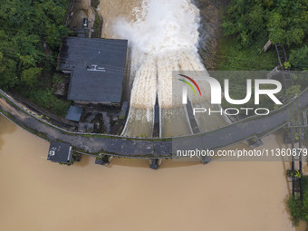 An aerial photo is showing the flood discharge at the Yongli Hydropower Station in Congjiang County, Southwest China's Guizhou Province, on...