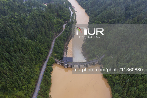 An aerial photo is showing the flood discharge at the Yongli Hydropower Station in Congjiang County, Southwest China's Guizhou Province, on...