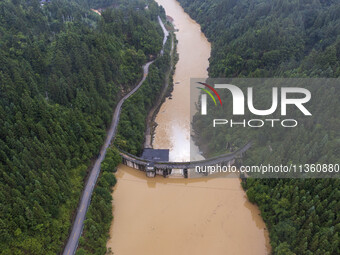 An aerial photo is showing the flood discharge at the Yongli Hydropower Station in Congjiang County, Southwest China's Guizhou Province, on...