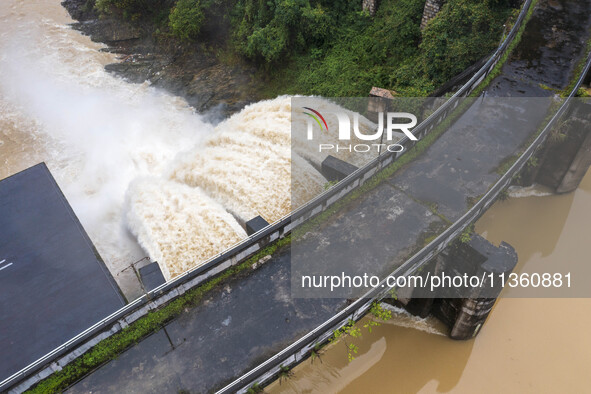 An aerial photo is showing the flood discharge at the Yongli Hydropower Station in Congjiang County, Southwest China's Guizhou Province, on...