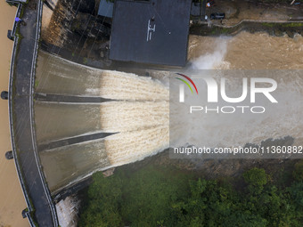 An aerial photo is showing the flood discharge at the Yongli Hydropower Station in Congjiang County, Southwest China's Guizhou Province, on...