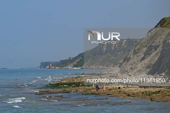 PORT-EN-BESSIN-HUPPAIN, FRANCE - JUNE 25: 
General view of the coastline at Port-en-Bessin, with cliffs subject to active erosion: landslide...