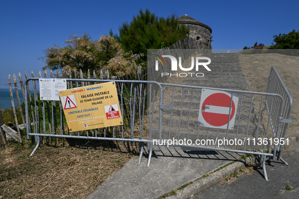 PORT-EN-BESSIN-HUPPAIN, FRANCE - JUNE 25: 
Access to Tour Vauban, a historic landmark in Port-en-Bessin-Huppain, blocked due to unstable cli...