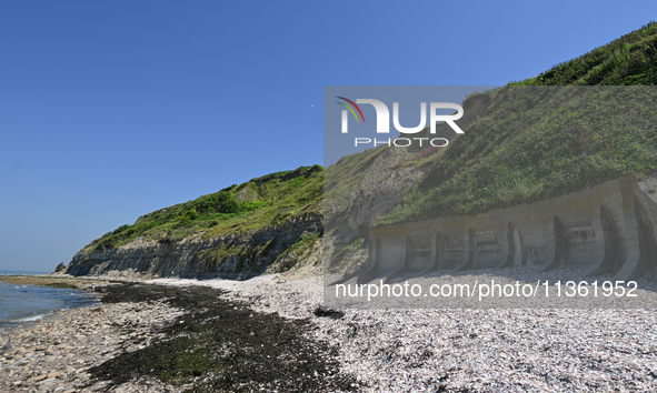 PORT-EN-BESSIN-HUPPAIN, FRANCE - JUNE 25: 
General view of the coastline at Port-en-Bessin, with cliffs subject to active erosion: landslide...