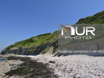 PORT-EN-BESSIN-HUPPAIN, FRANCE - JUNE 25: 
General view of the coastline at Port-en-Bessin, with cliffs subject to active erosion: landslide...