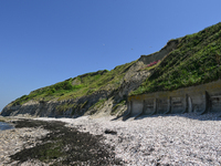 PORT-EN-BESSIN-HUPPAIN, FRANCE - JUNE 25: 
General view of the coastline at Port-en-Bessin, with cliffs subject to active erosion: landslide...