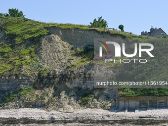 PORT-EN-BESSIN-HUPPAIN, FRANCE - JUNE 25: 
General view of the coastline at Port-en-Bessin, with cliffs subject to active erosion: landslide...