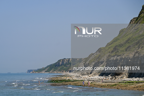 PORT-EN-BESSIN-HUPPAIN, FRANCE - JUNE 25: 
General view of the coastline at Port-en-Bessin, with cliffs subject to active erosion: landslide...