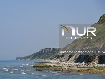 PORT-EN-BESSIN-HUPPAIN, FRANCE - JUNE 25: 
General view of the coastline at Port-en-Bessin, with cliffs subject to active erosion: landslide...