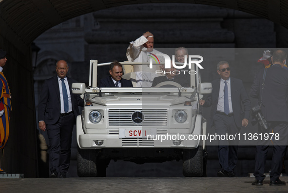 Pope Francis is arriving on the popemobile for the weekly general audience in The Vatican, on June 26, 2024, at St Peter's Square. 