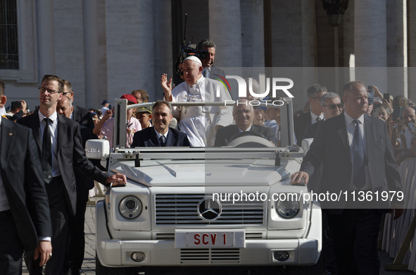 Pope Francis is arriving on the popemobile for the weekly general audience in The Vatican, on June 26, 2024, at St Peter's Square. 