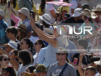 People are taking photos during Pope Francis' weekly general audience in The Vatican, on June 26, 2024, at St. Peter's Square. (