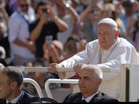 Pope Francis is arriving for his weekly general audience in St. Peter's Square at the Vatican, on June 26, 2024. (