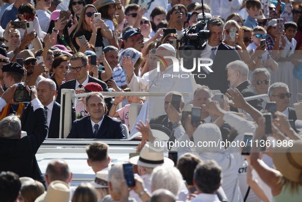 Pope Francis is arriving for his weekly general audience in St. Peter's Square at the Vatican, on June 26, 2024. 