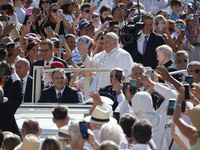 Pope Francis is arriving for his weekly general audience in St. Peter's Square at the Vatican, on June 26, 2024. (