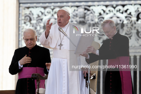 Pope Francis is making the sign of the cross during the weekly general audience in The Vatican, on June 26, 2024, at St Peter's Square. 