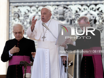 Pope Francis is making the sign of the cross during the weekly general audience in The Vatican, on June 26, 2024, at St Peter's Square. (