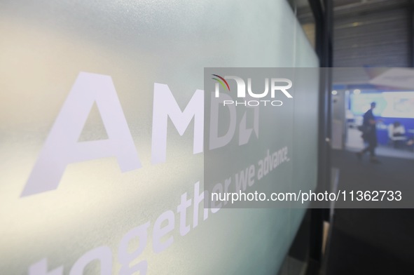 Visitors are walking past the AMD booth at the 2024 Mobile World Congress (MWC Shanghai) in Shanghai, China, on June 26, 2024. 