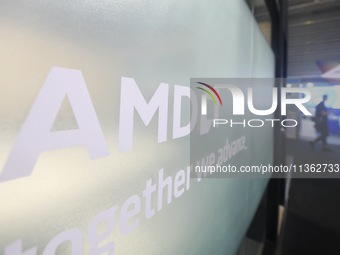 Visitors are walking past the AMD booth at the 2024 Mobile World Congress (MWC Shanghai) in Shanghai, China, on June 26, 2024. (