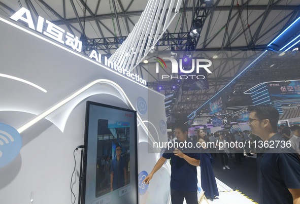 Visitors are experiencing H3C's AI photo shoot at the 2024 Mobile World Congress (MWC Shanghai) in Shanghai, China, on June 26, 2024. 