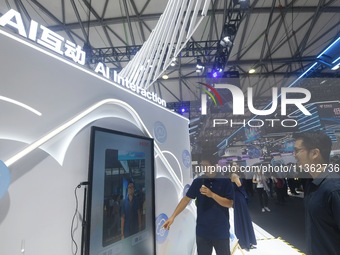 Visitors are experiencing H3C's AI photo shoot at the 2024 Mobile World Congress (MWC Shanghai) in Shanghai, China, on June 26, 2024. (