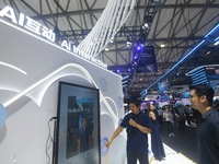 Visitors are experiencing H3C's AI photo shoot at the 2024 Mobile World Congress (MWC Shanghai) in Shanghai, China, on June 26, 2024. (