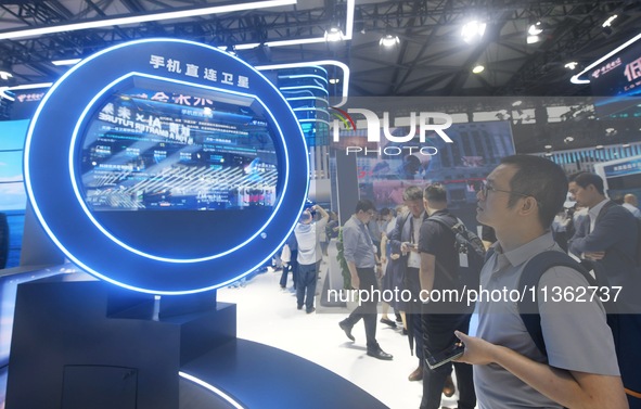 Visitors are checking out direct satellite technology for mobile phones at the 2024 Mobile World Congress (MWC Shanghai) in Shanghai, China,...