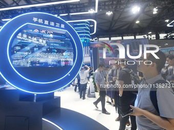 Visitors are checking out direct satellite technology for mobile phones at the 2024 Mobile World Congress (MWC Shanghai) in Shanghai, China,...