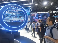 Visitors are checking out direct satellite technology for mobile phones at the 2024 Mobile World Congress (MWC Shanghai) in Shanghai, China,...