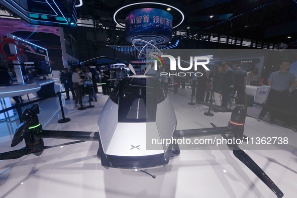 Visitors are visiting Xpeng's ''Voyager X2'' flying car at the 2024 Mobile World Congress (MWC Shanghai) in Shanghai, China, on June 26, 202...