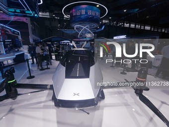 Visitors are visiting Xpeng's ''Voyager X2'' flying car at the 2024 Mobile World Congress (MWC Shanghai) in Shanghai, China, on June 26, 202...