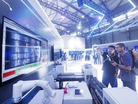 Visitors are visiting an ''AI+ Factory'' demonstration model at the 2024 Mobile World Congress (MWC Shanghai) in Shanghai, China, on June 26...