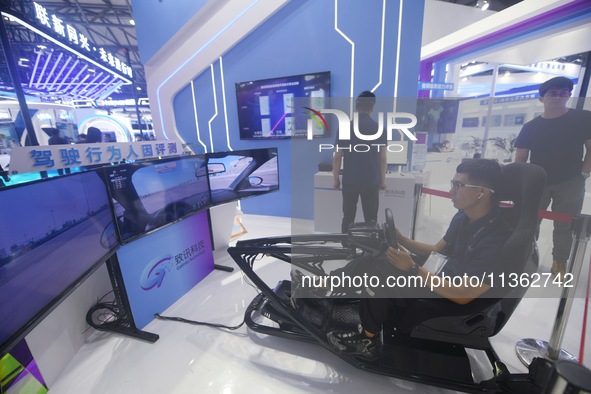 Visitors are experiencing human factors evaluation in intelligent driving at the 2024 Mobile World Congress (MWC Shanghai) in Shanghai, Chin...