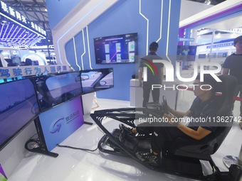 Visitors are experiencing human factors evaluation in intelligent driving at the 2024 Mobile World Congress (MWC Shanghai) in Shanghai, Chin...