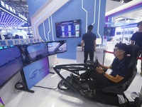 Visitors are experiencing human factors evaluation in intelligent driving at the 2024 Mobile World Congress (MWC Shanghai) in Shanghai, Chin...