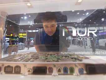 Visitors are visiting NIO's central computing platform featuring Nvidia's car-scale chips at the 2024 Mobile World Congress (MWC Shanghai) i...