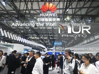 Foreign visitors are visiting Huawei's stand at the 2024 Mobile World Congress (MWC Shanghai) in Shanghai, China, on June 26, 2024. (