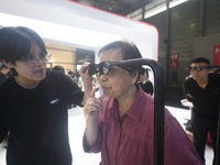 Foreign visitors are experiencing smart XR glasses at the 2024 Mobile World Congress (MWC Shanghai) in Shanghai, China, on June 26, 2024. (