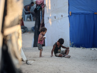 Displaced Palestinian children are playing at a camp for displaced Palestinians in Deir al-Balah, in the central Gaza Strip, on June 26, 202...