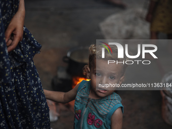 Displaced Palestinian children are staying at a camp for displaced Palestinians in Deir al-Balah, in the central Gaza Strip, on June 26, 202...